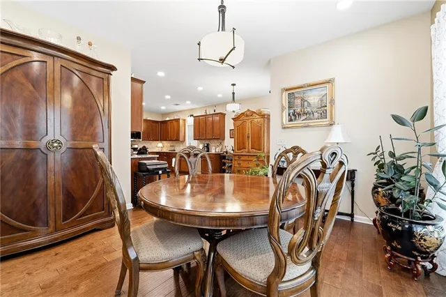 a dining room with furniture and wooden floor