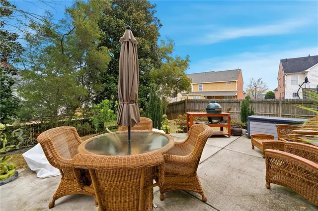 a swimming pool with outdoor seating and yard