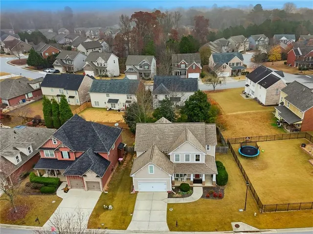 an aerial view of residential houses with outdoor space