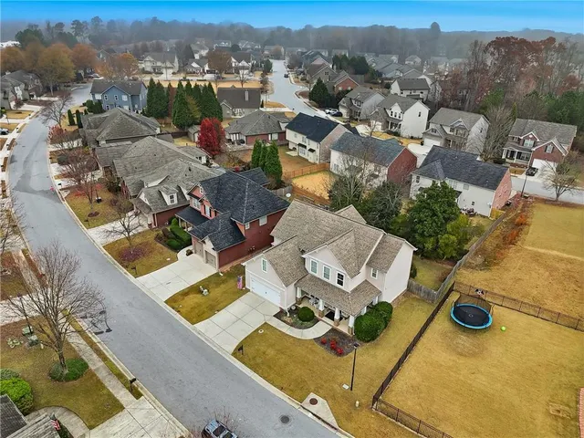 an aerial view of a house with a garden