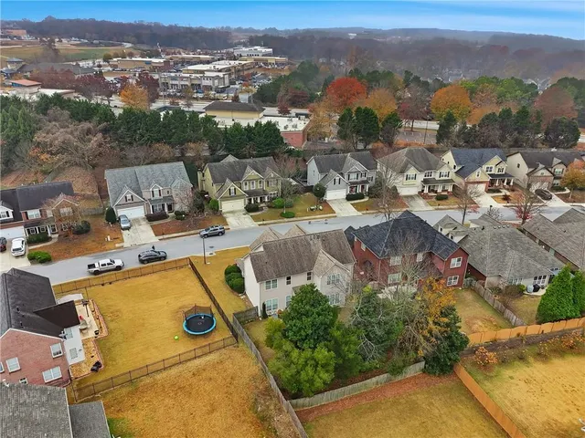an aerial view of residential house with outdoor space and mountain view