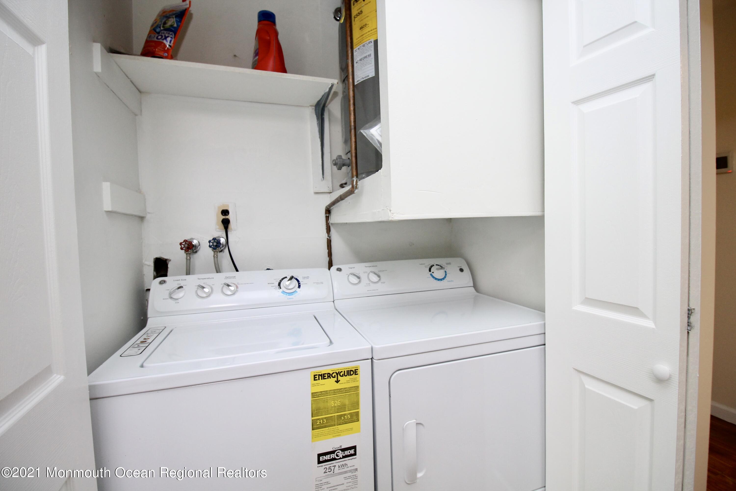 152 Cours De Pasteur, Unit E Freehold, NJ 07728 - Photo 13 of 21 a utility room with dryer and washer