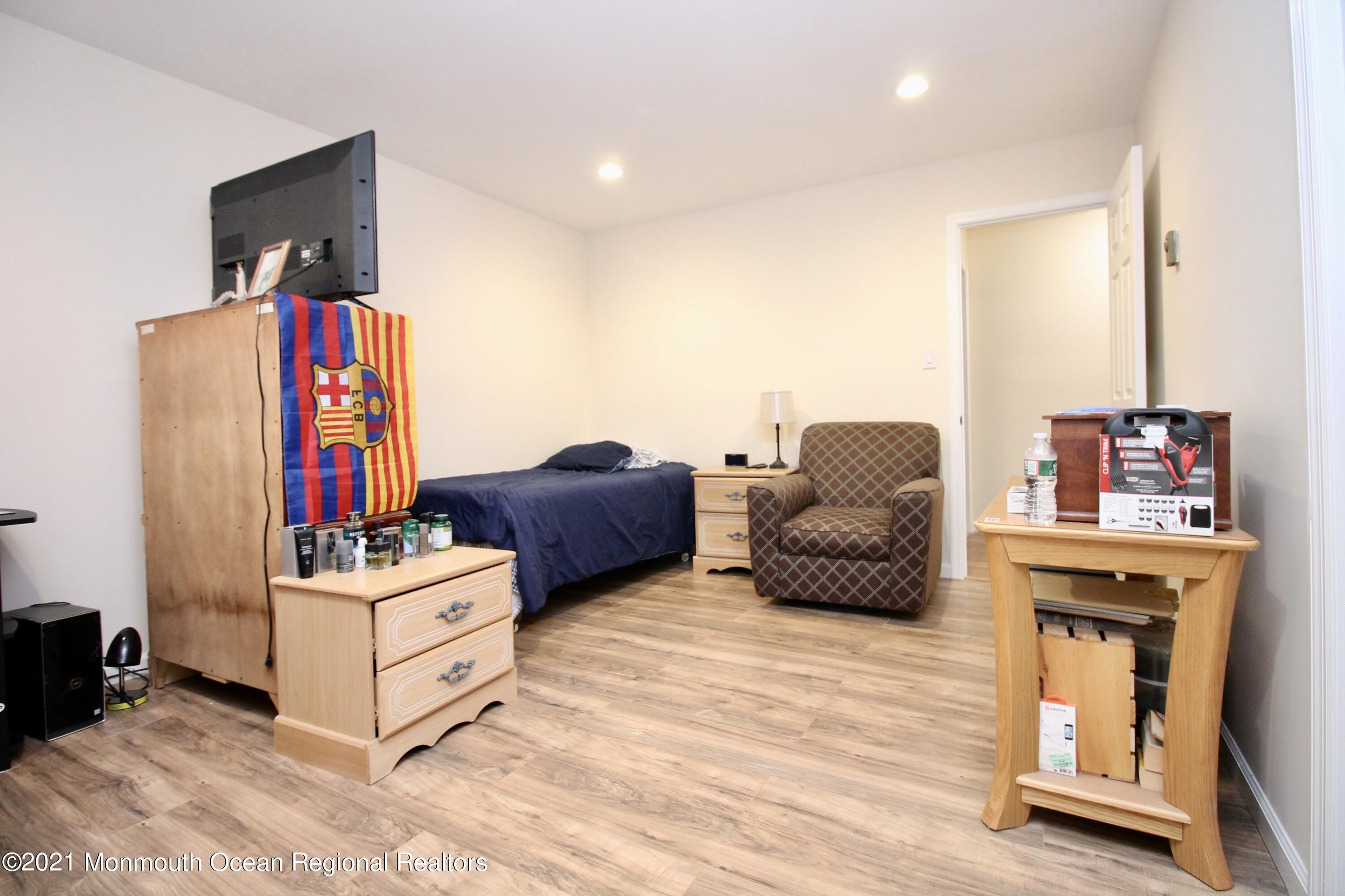 152 Cours De Pasteur, Unit E Freehold, NJ 07728 - Photo 15 of 21 a living room with furniture and a couch