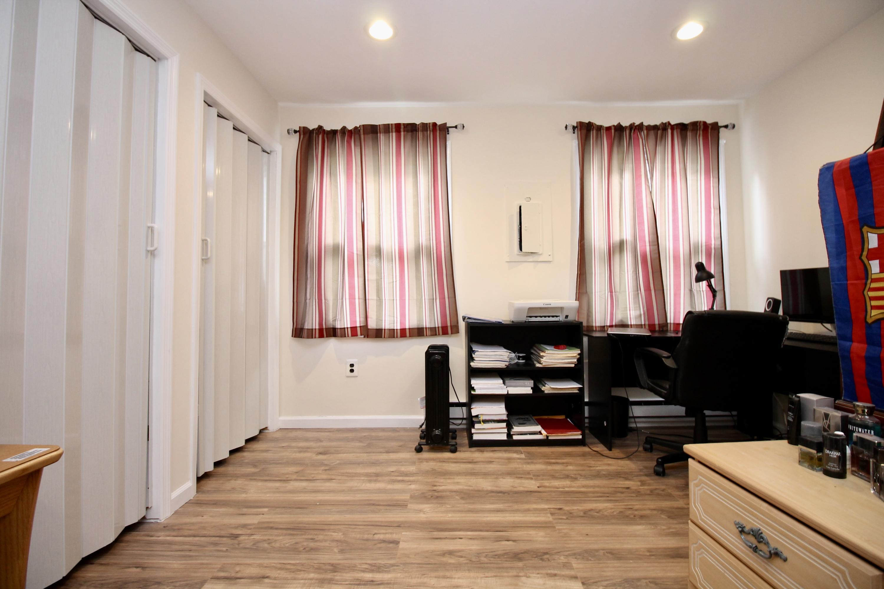 152 Cours De Pasteur, Unit E Freehold, NJ 07728 - Photo 16 of 21 a view of a livingroom with furniture and a window