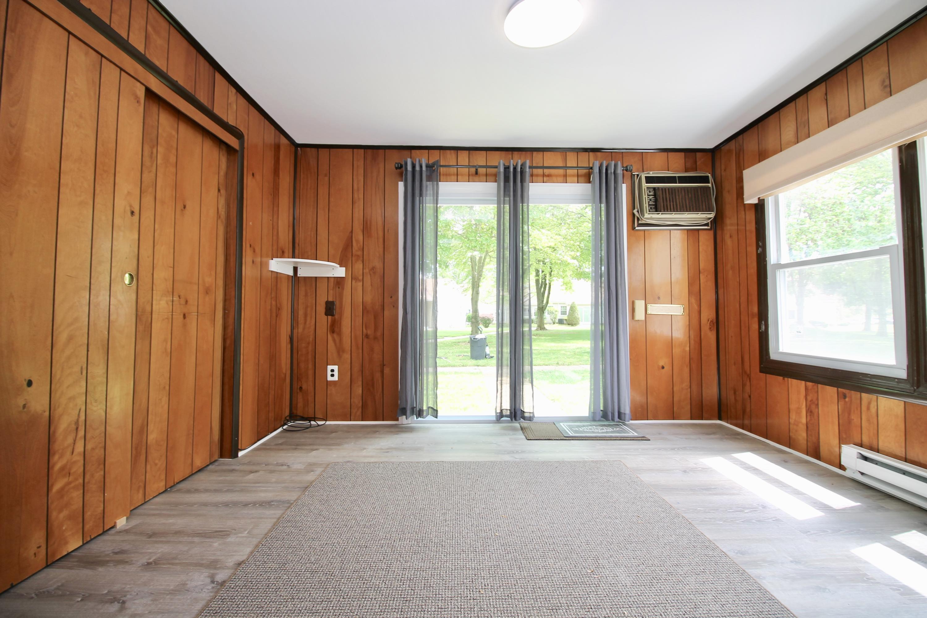 152 Cours De Pasteur, Unit E Freehold, NJ 07728 - Photo 17 of 21 a view of an empty room with a window