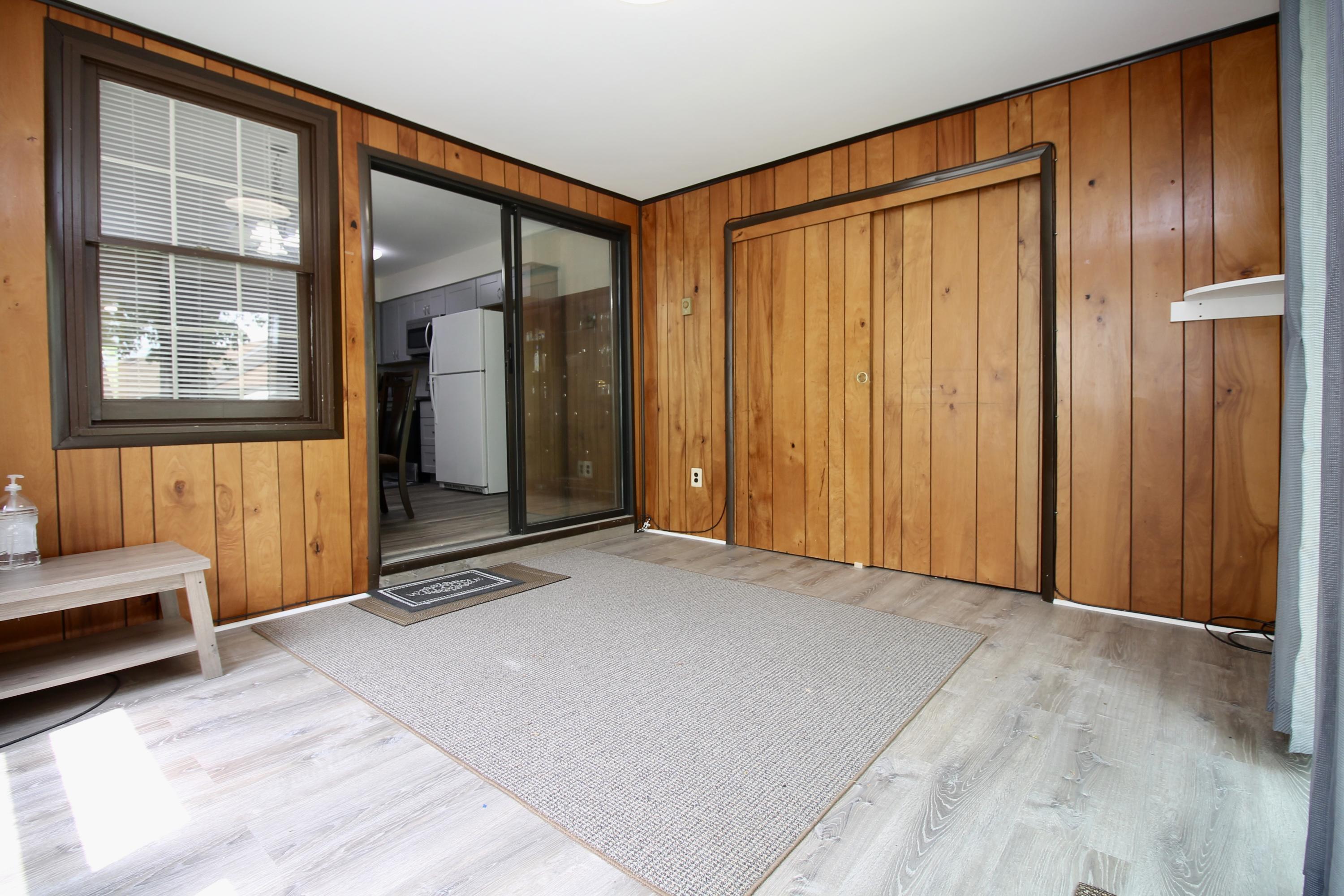 152 Cours De Pasteur, Unit E Freehold, NJ 07728 - Photo 18 of 21 a view of an empty room with a window
