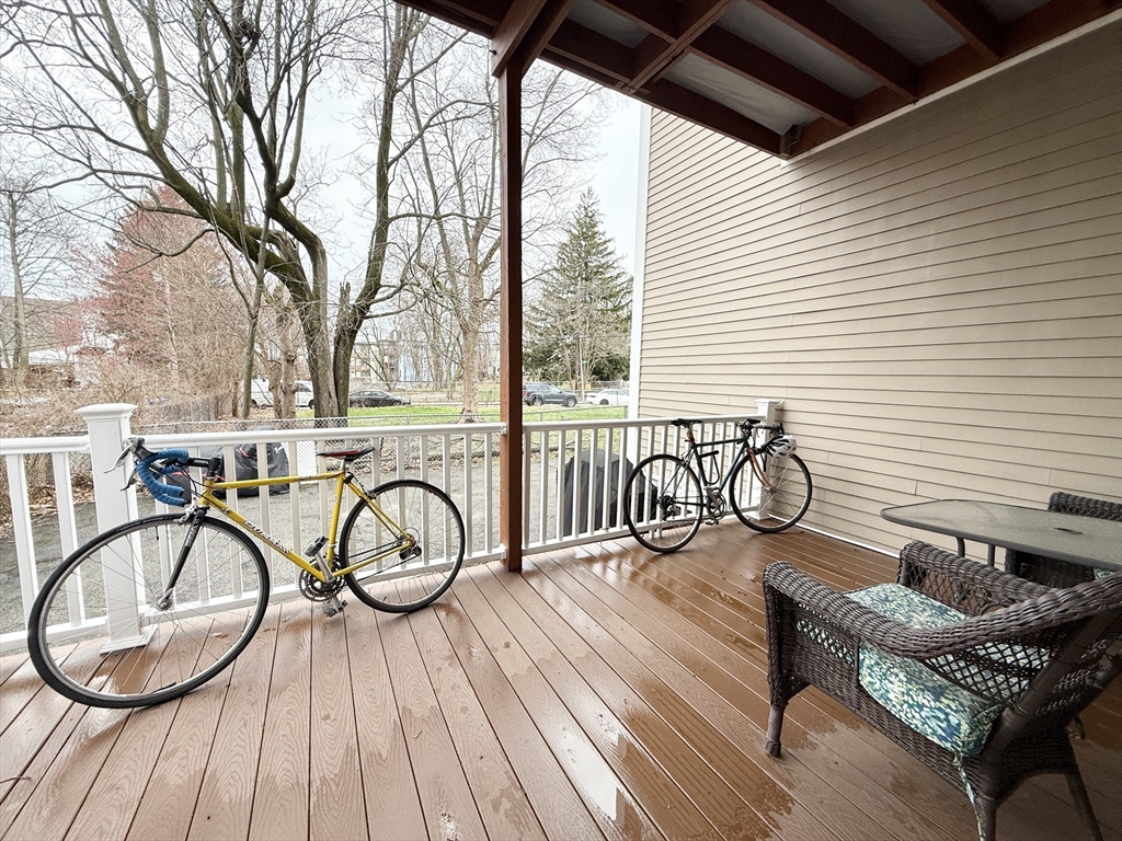 36 Hawthorne Street, Unit 1 Boston, MA 02119 - Photo 4 of 12 a bike park with table and chairs