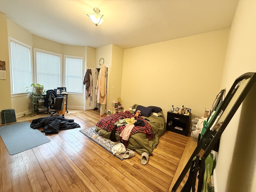 36 Hawthorne Street, Unit 1 Boston, MA 02119 - Photo 8 of 12 a living room with furniture and wooden floor