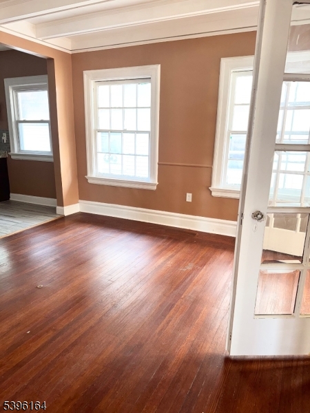 42 Clinton Place, Unit 2 Newark, NJ 07108 - Photo 5 of 20 an empty room with wooden floor and windows