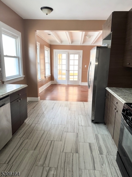 42 Clinton Place, Unit 2 Newark, NJ 07108 - Photo 7 of 20 a view of a kitchen with wooden floor and a window