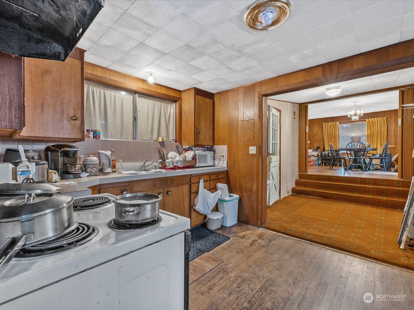 8832 Interlake Avenue North Seattle, WA 98103 - Photo 11 of 29 a kitchen that has a lot of cabinets in it