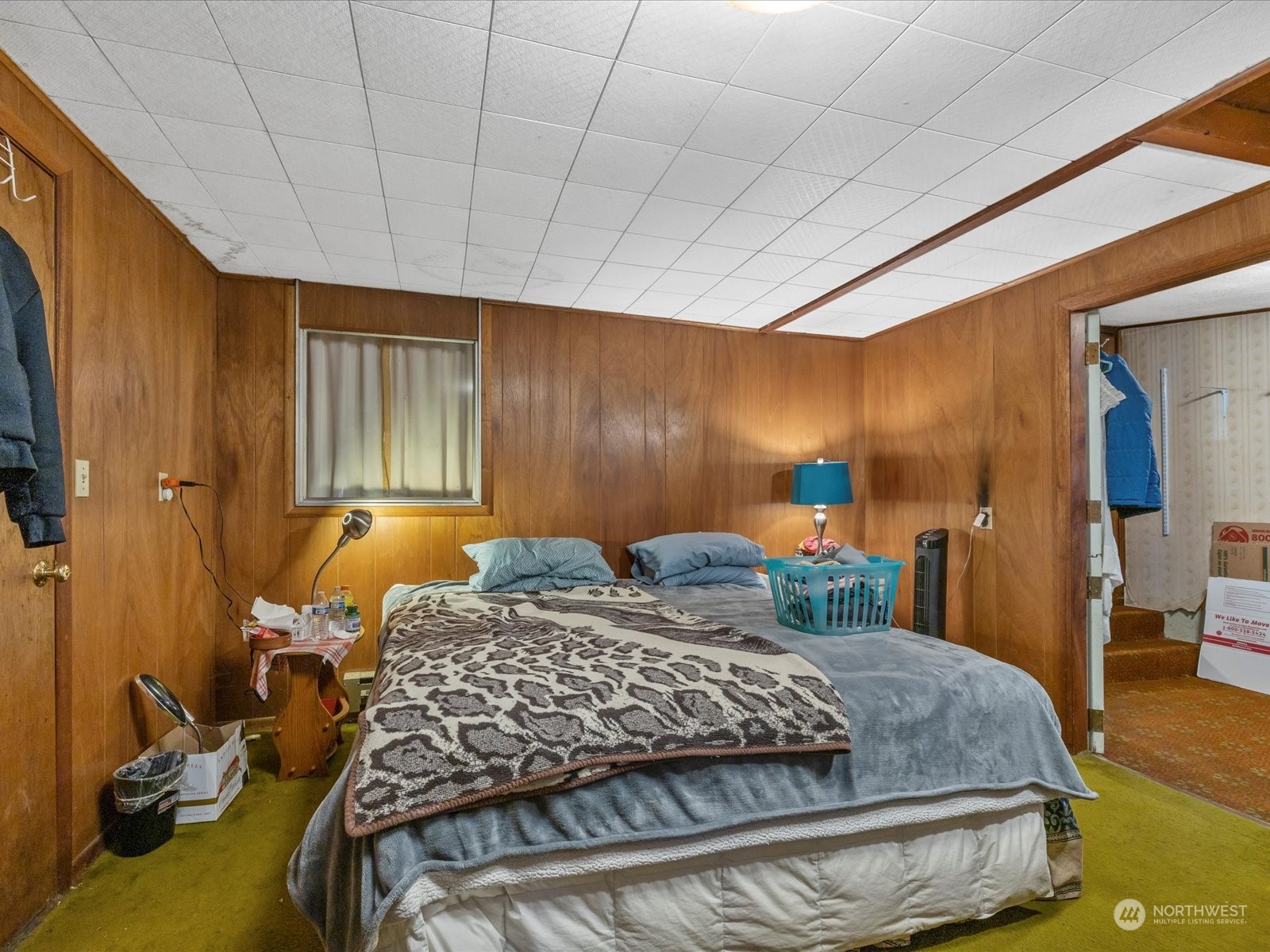8832 Interlake Avenue North Seattle, WA 98103 - Photo 12 of 29 a bedroom with a bed and wooden floor