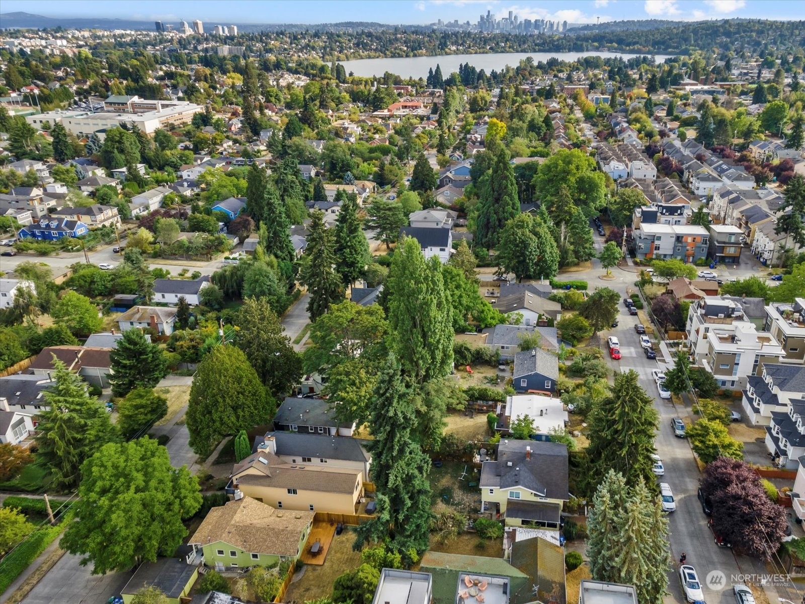 8832 Interlake Avenue North Seattle, WA 98103 - Photo 27 of 29 an aerial view of residential houses with outdoor space and trees