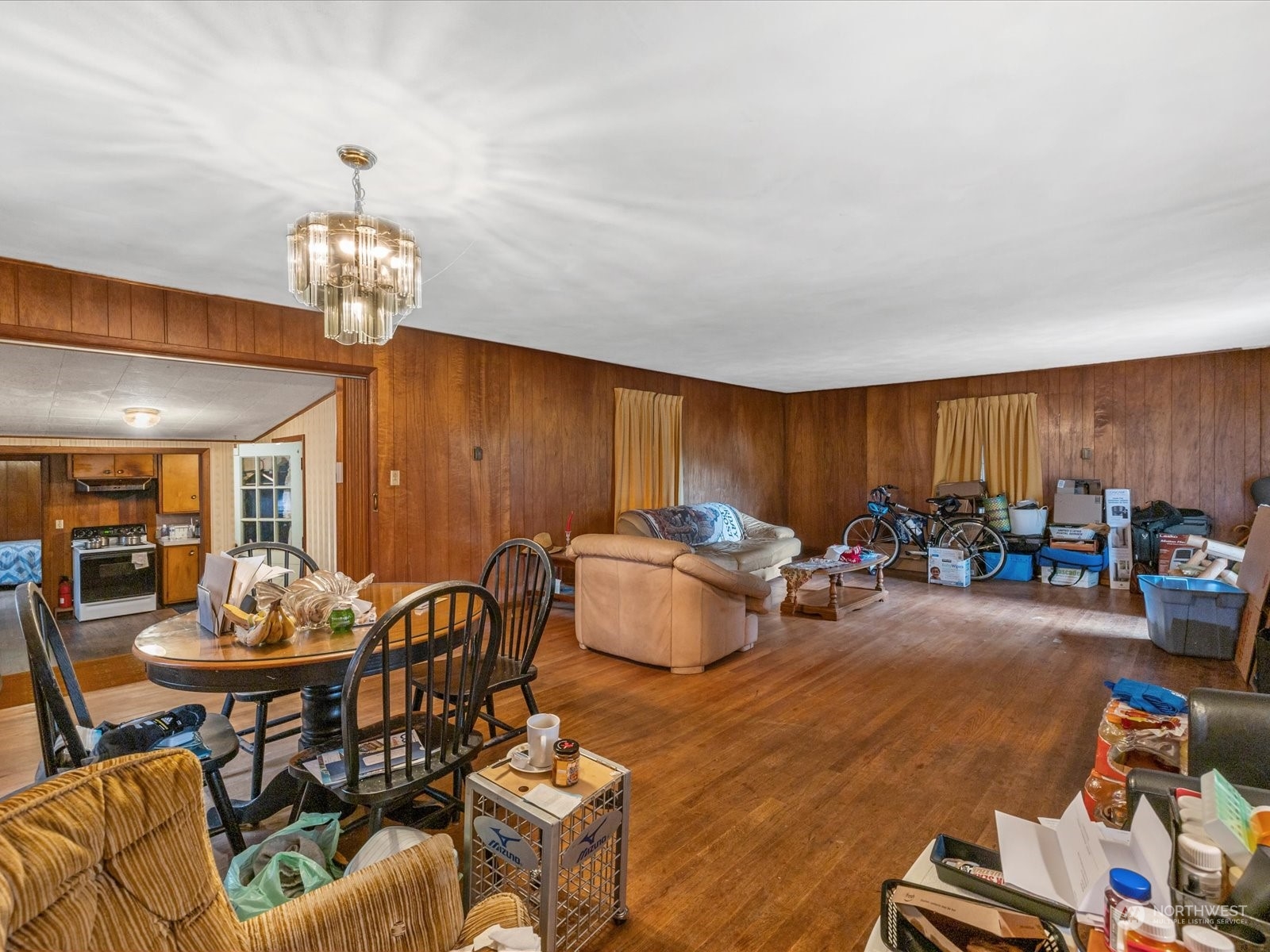 8832 Interlake Avenue North Seattle, WA 98103 - Photo 6 of 29 a living room with furniture and a chandelier