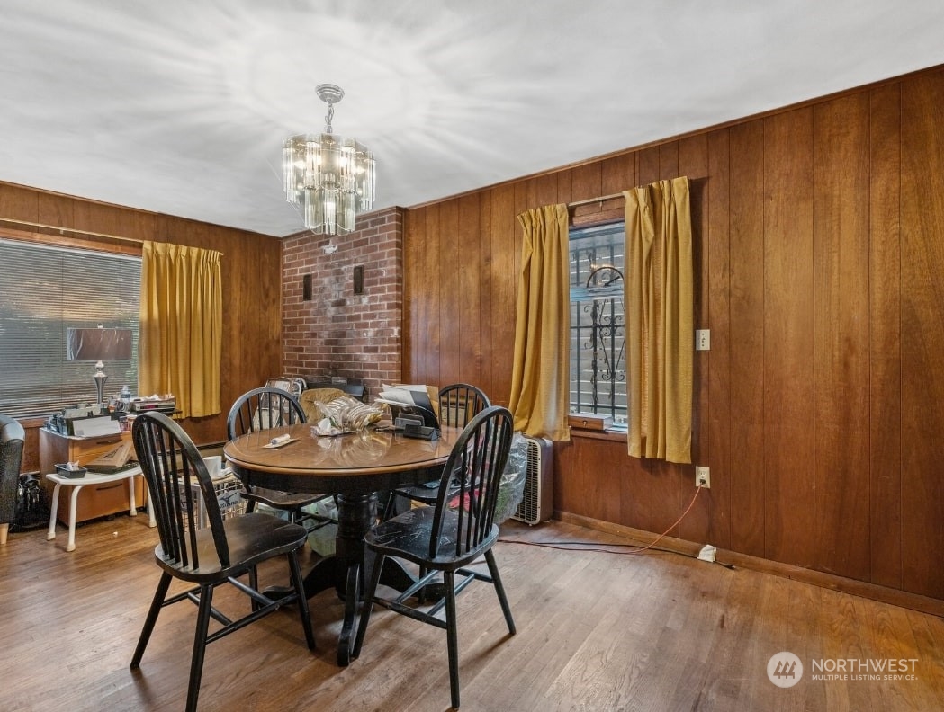 8832 Interlake Avenue North Seattle, WA 98103 - Photo 7 of 29 a view of a a dining room with furniture window and wooden floor