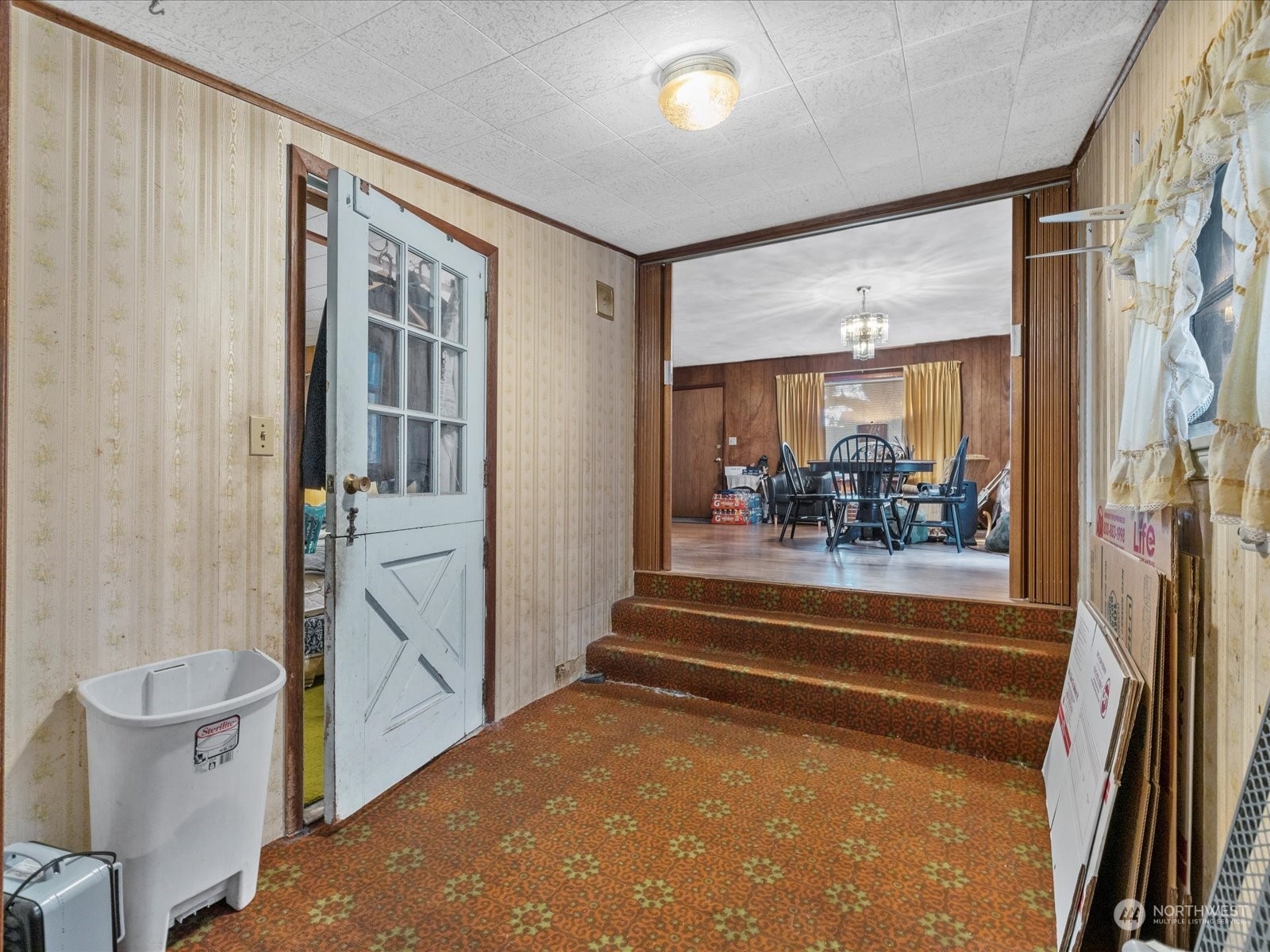 8832 Interlake Avenue North Seattle, WA 98103 - Photo 8 of 29 a view of a hallway and a livingroom with furniture