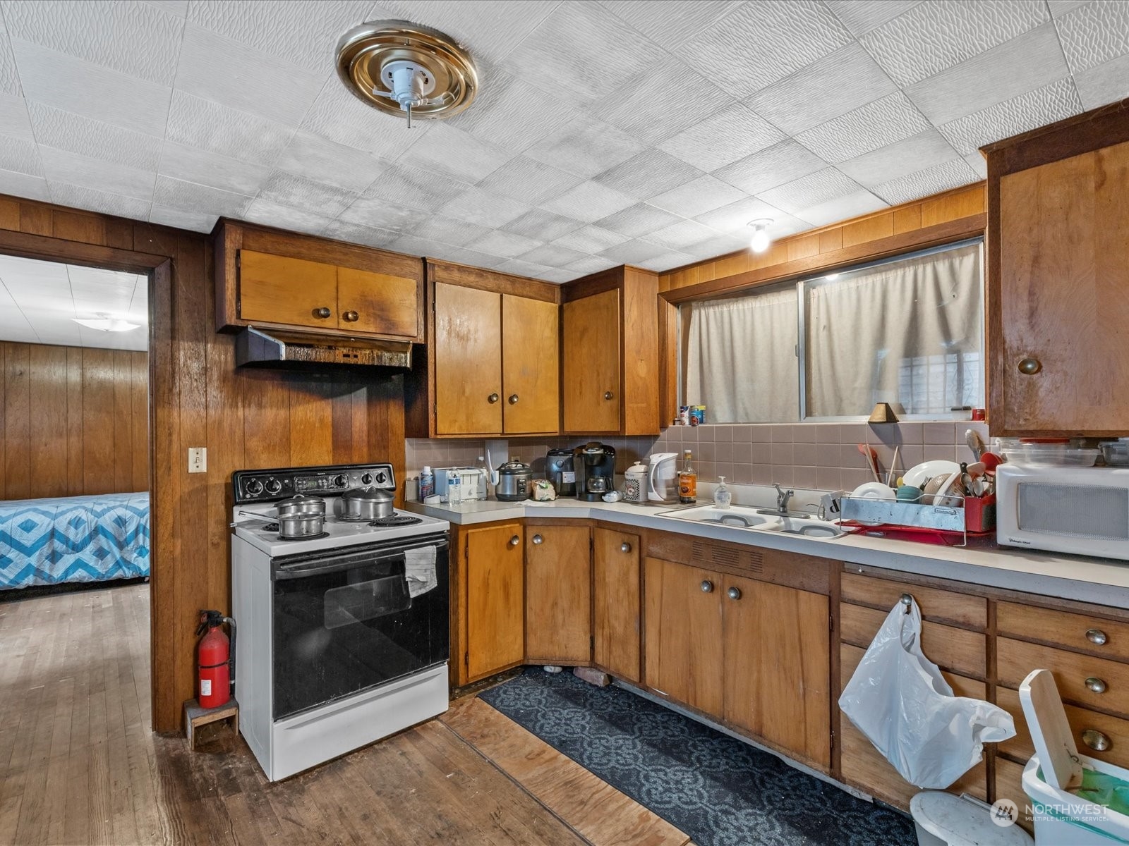 8832 Interlake Avenue North Seattle, WA 98103 - Photo 9 of 29 a kitchen with a stove and a sink