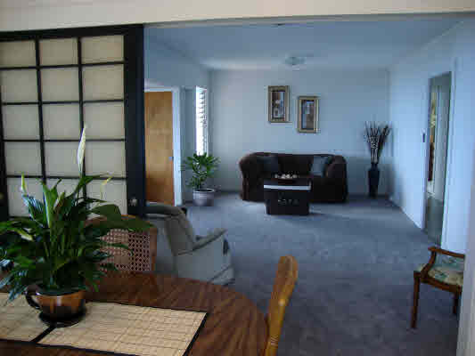 81-1018 Captain Cook Road Captain Cook, HI 96704 - Photo 11 of 24 a living room with furniture potted plant and a window