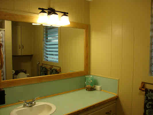 81-1018 Captain Cook Road Captain Cook, HI 96704 - Photo 23 of 24 a bathroom with a sink and a mirror