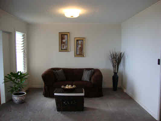 81-1018 Captain Cook Road Captain Cook, HI 96704 - Photo 10 of 24 a living room with furniture and a potted plant