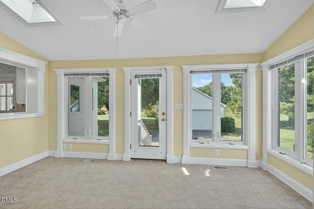 a view of a bathroom with a shower and a sink