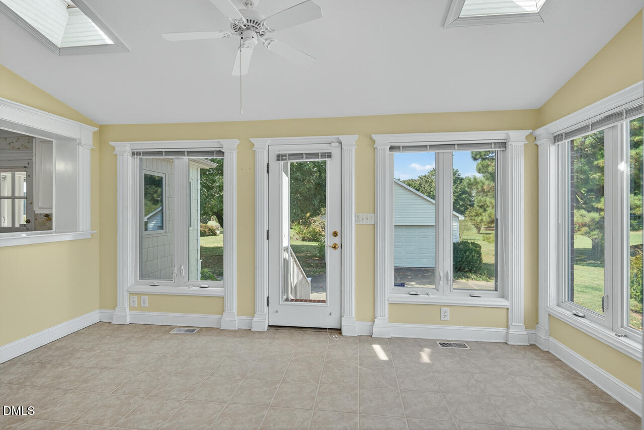 720 Roxboro Road Haw River, NC 27258 - Photo 9 of 55 an empty room with windows and closet