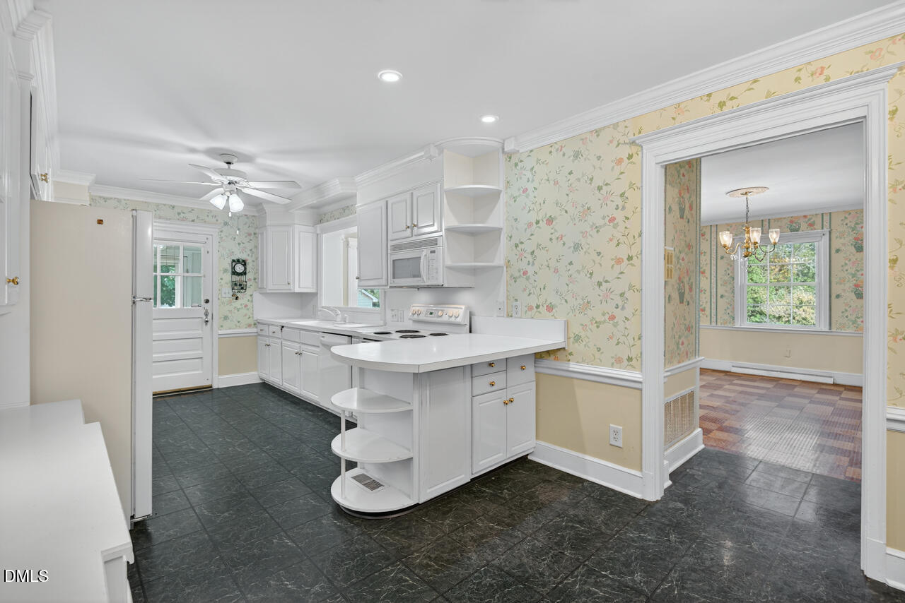 720 Roxboro Road Haw River, NC 27258 - Photo 14 of 55 a bathroom with a sink double vanity and a mirror