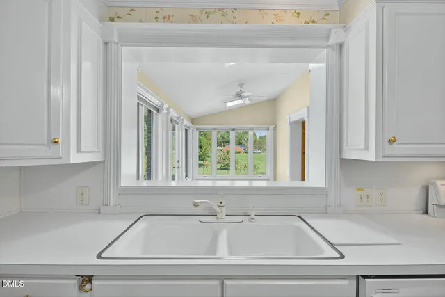 a view of a kitchen and window