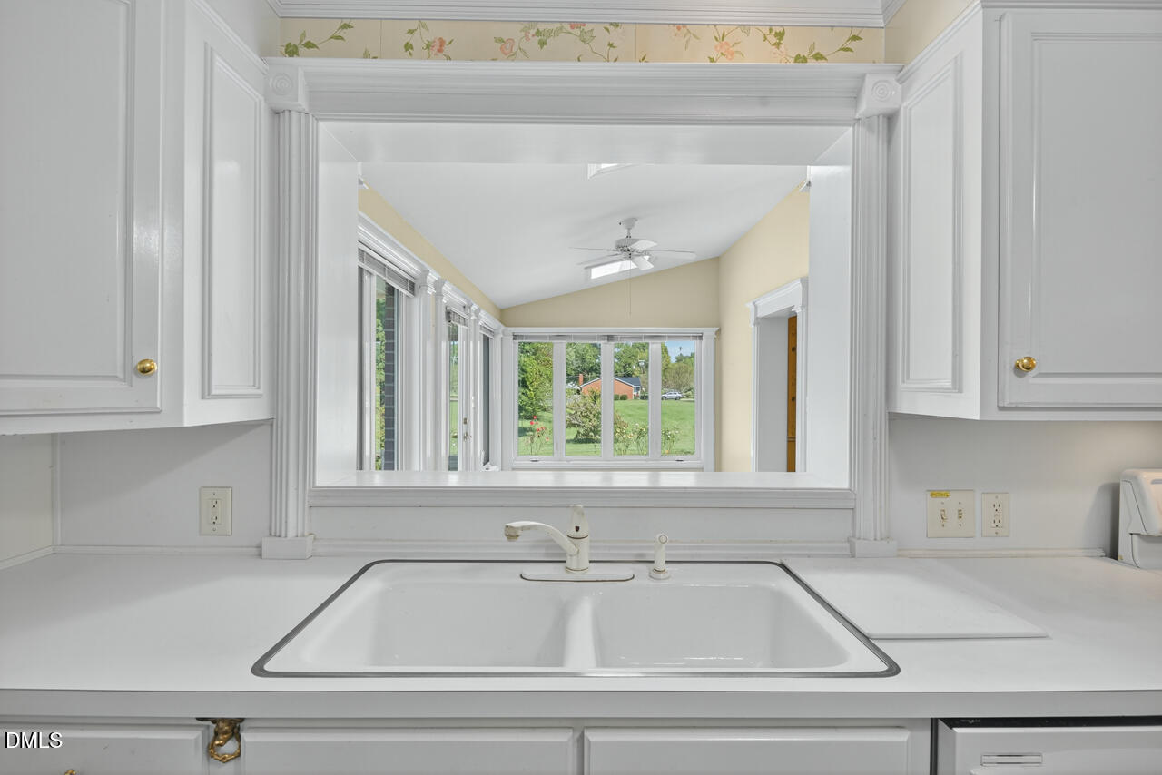 720 Roxboro Road Haw River, NC 27258 - Photo 18 of 55 a bathroom with washing machine and window