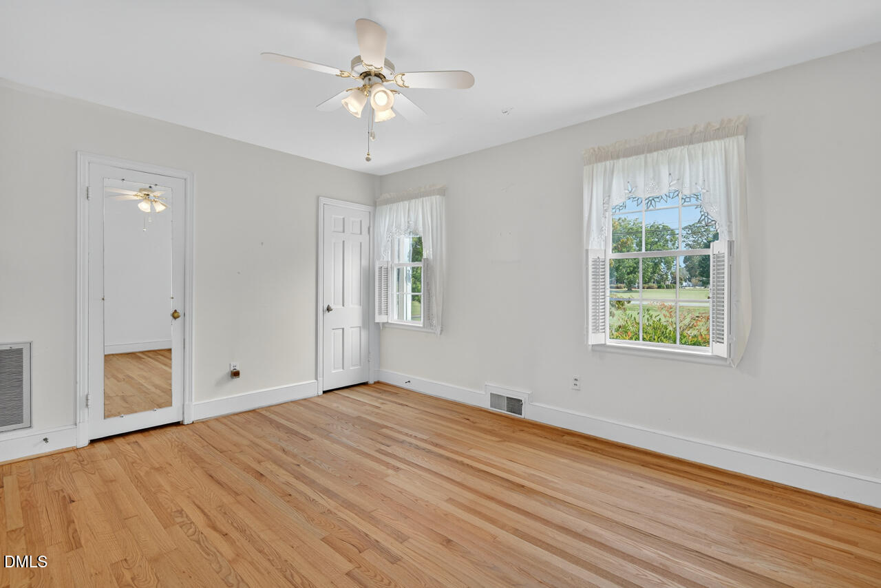 720 Roxboro Road Haw River, NC 27258 - Photo 21 of 55 a view of an empty room with a window