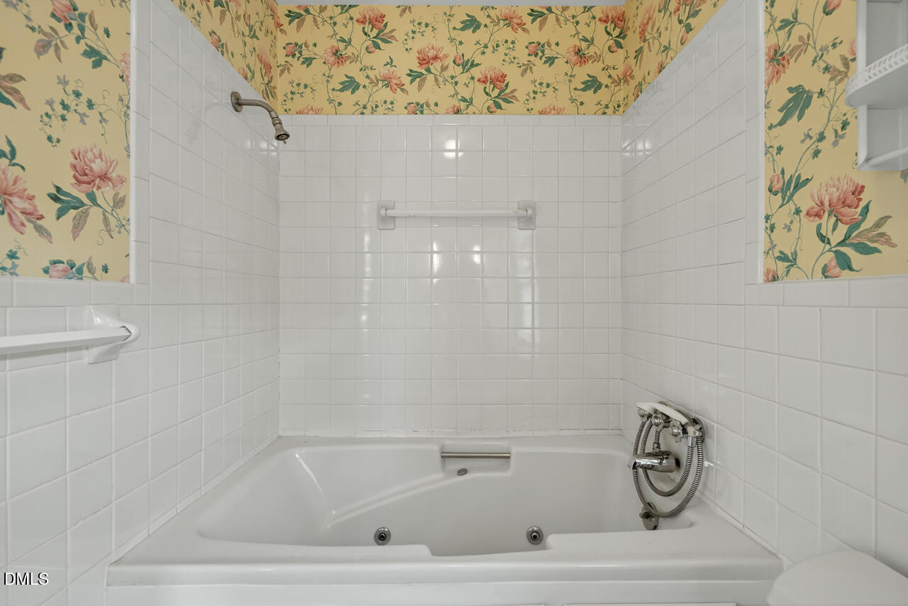 720 Roxboro Road Haw River, NC 27258 - Photo 25 of 55 a bathroom with a bathtub and a shower