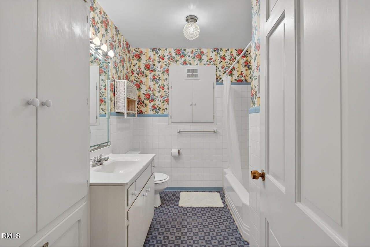 720 Roxboro Road Haw River, NC 27258 - Photo 27 of 55 a bathroom with a sink a toilet and shower