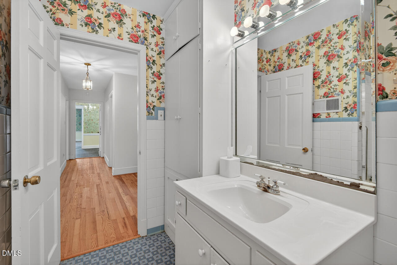 720 Roxboro Road Haw River, NC 27258 - Photo 28 of 55 a en suite bathroom with a sink double vanity and mirror