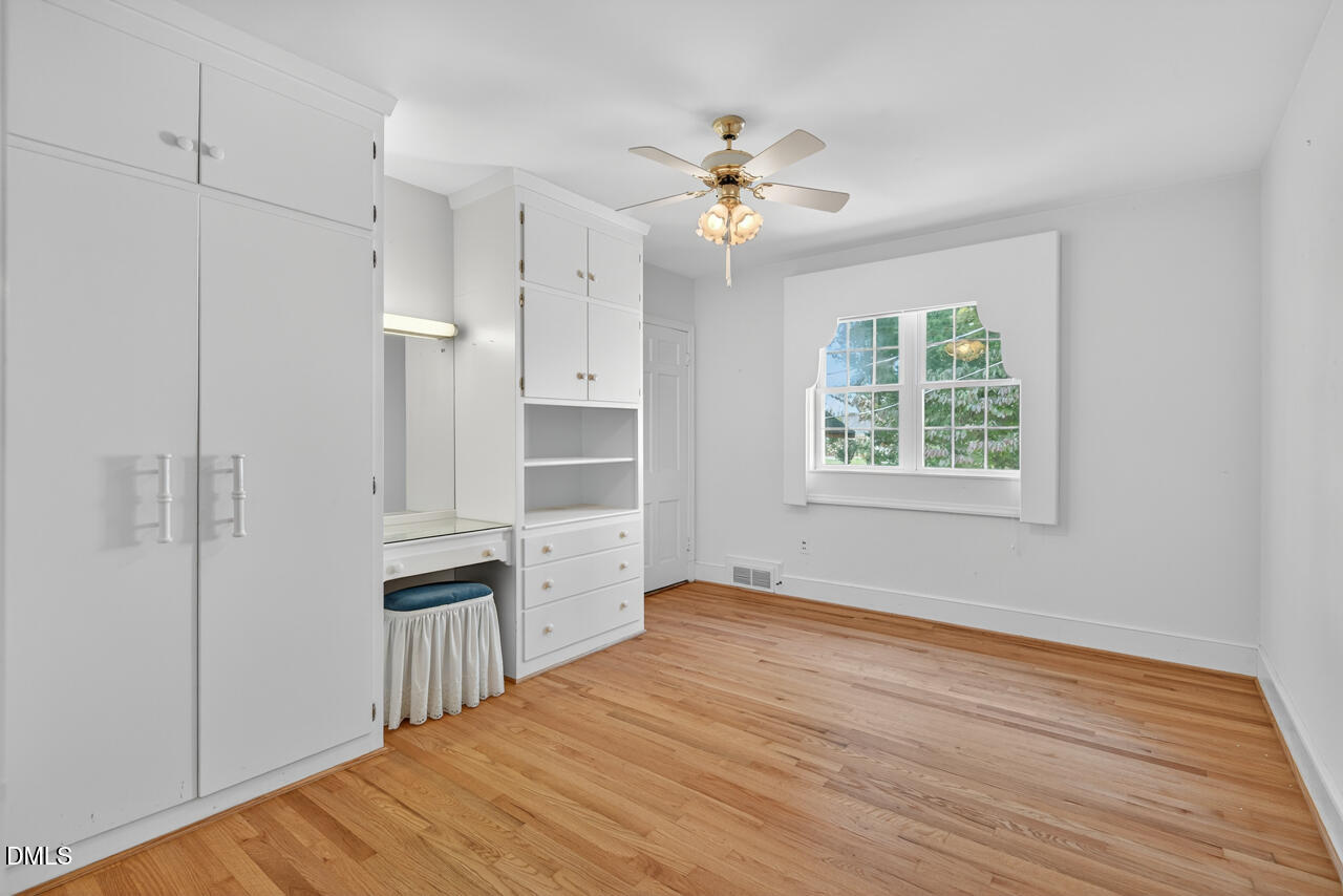 720 Roxboro Road Haw River, NC 27258 - Photo 30 of 55 a view of empty room with wooden floor and fan