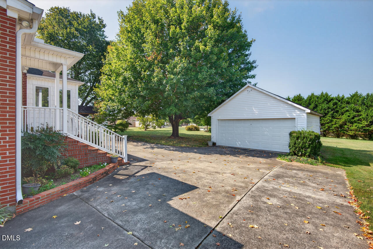 720 Roxboro Road Haw River, NC 27258 - Photo 39 of 55 a view of a house with a yard