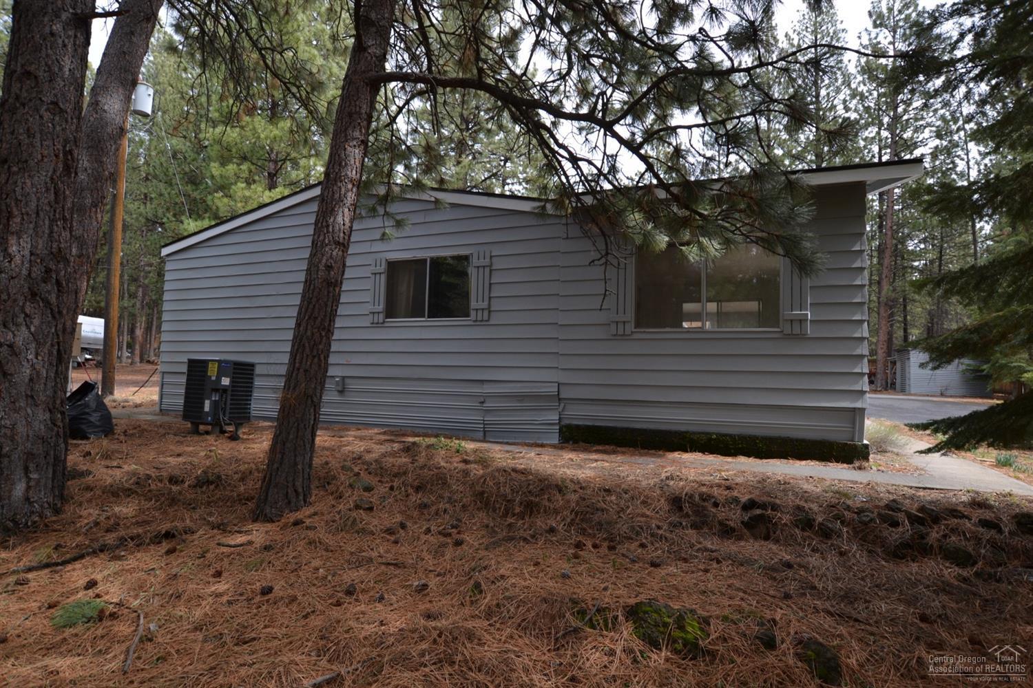 60176 Agate Road Bend, OR 97702 - Photo 21 of 21 a view of a house with a yard