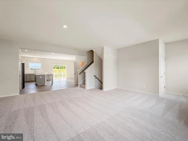 a view of an empty room with a fireplace