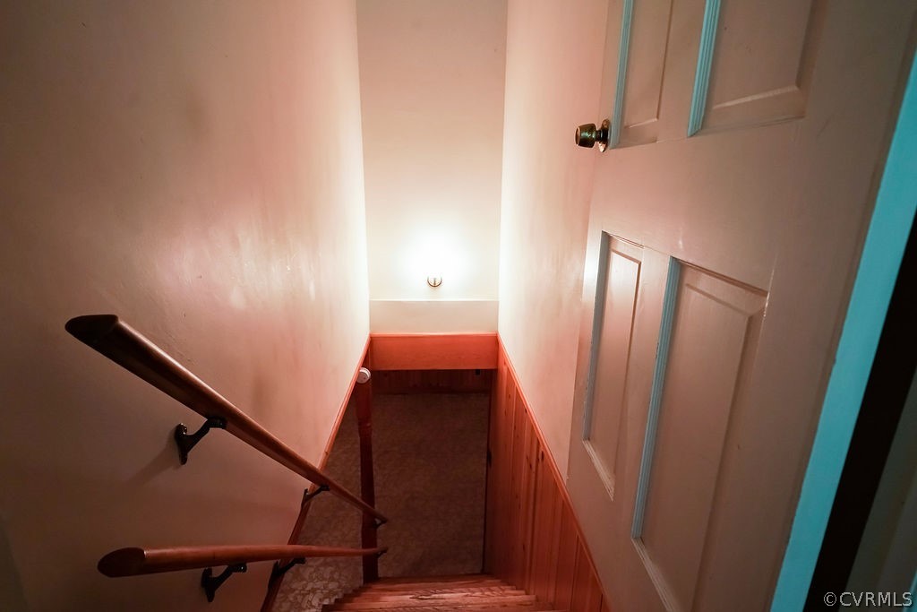 8531 Trabue Road North Chesterfield, VA 23235 - Photo 29 of 42 Hardwood stairs lead to bonus/rec room in basement