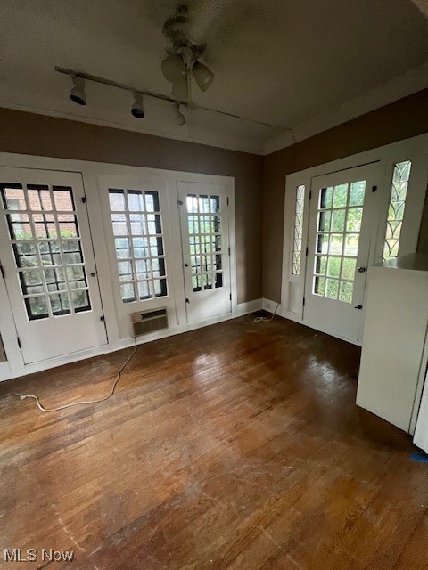 2915 Ludlow Road Cleveland, OH 44120 - Photo 26 of 50 Empty room with hardwood / wood-style floors, rail lighting, and crown molding