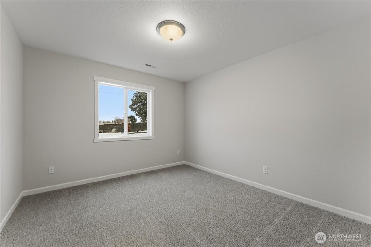 34 Simpson Street Mansfield, WA 98830 - Photo 18 of 29 an empty room with windows