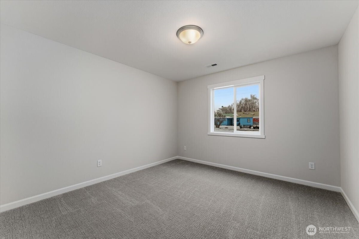 34 Simpson Street Mansfield, WA 98830 - Photo 21 of 29 an empty room with a window