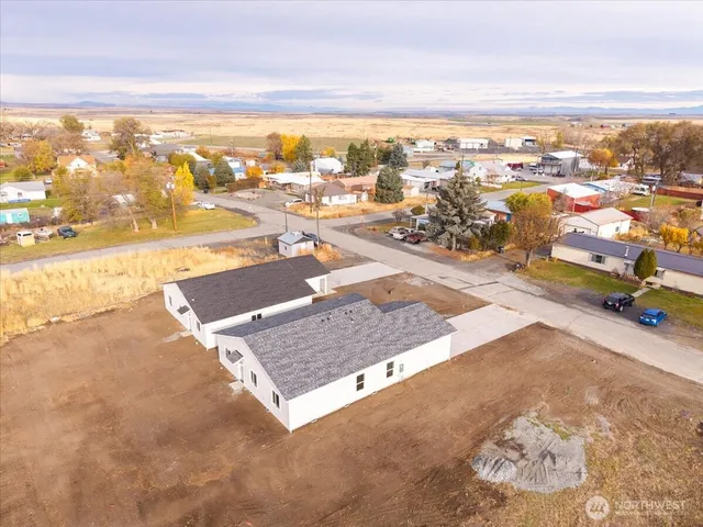 an aerial view of residential houses with outdoor space