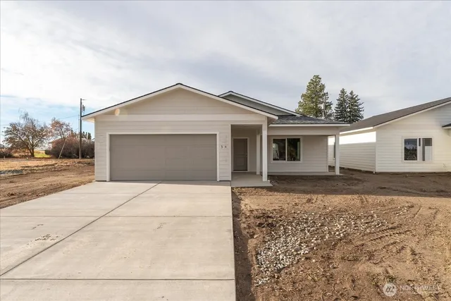 a view of a hallway with wooden shelves