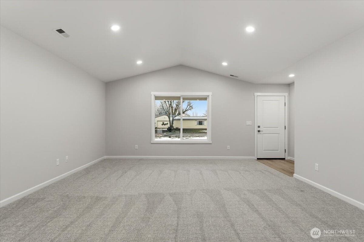 34 Simpson Street Mansfield, WA 98830 - Photo 9 of 29 a view of an empty room with a window