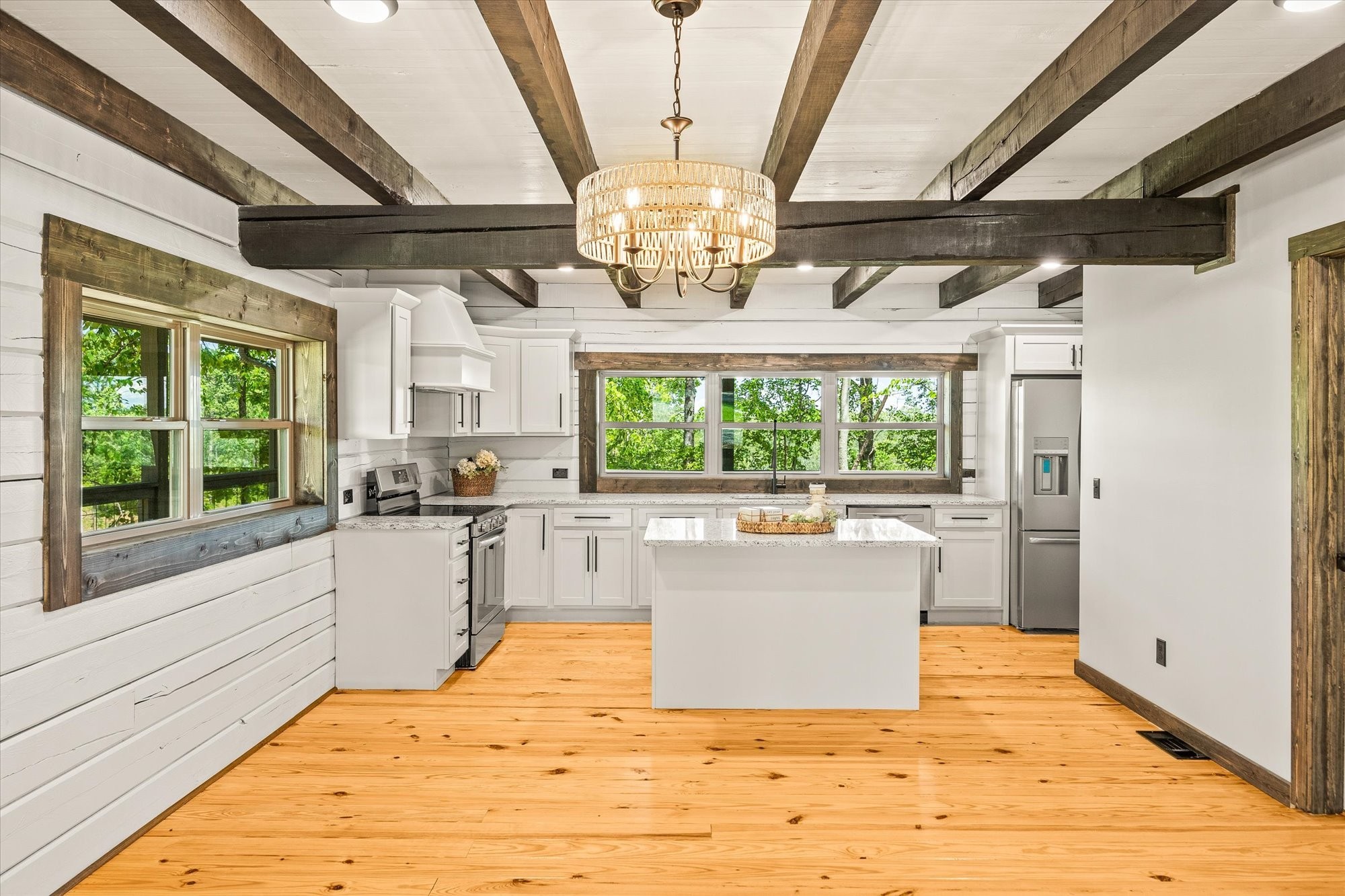 4221 New Hope Road Celina, TN 38551 - Photo 20 of 52 a living room with stainless steel appliances granite countertop furniture and a chandelier