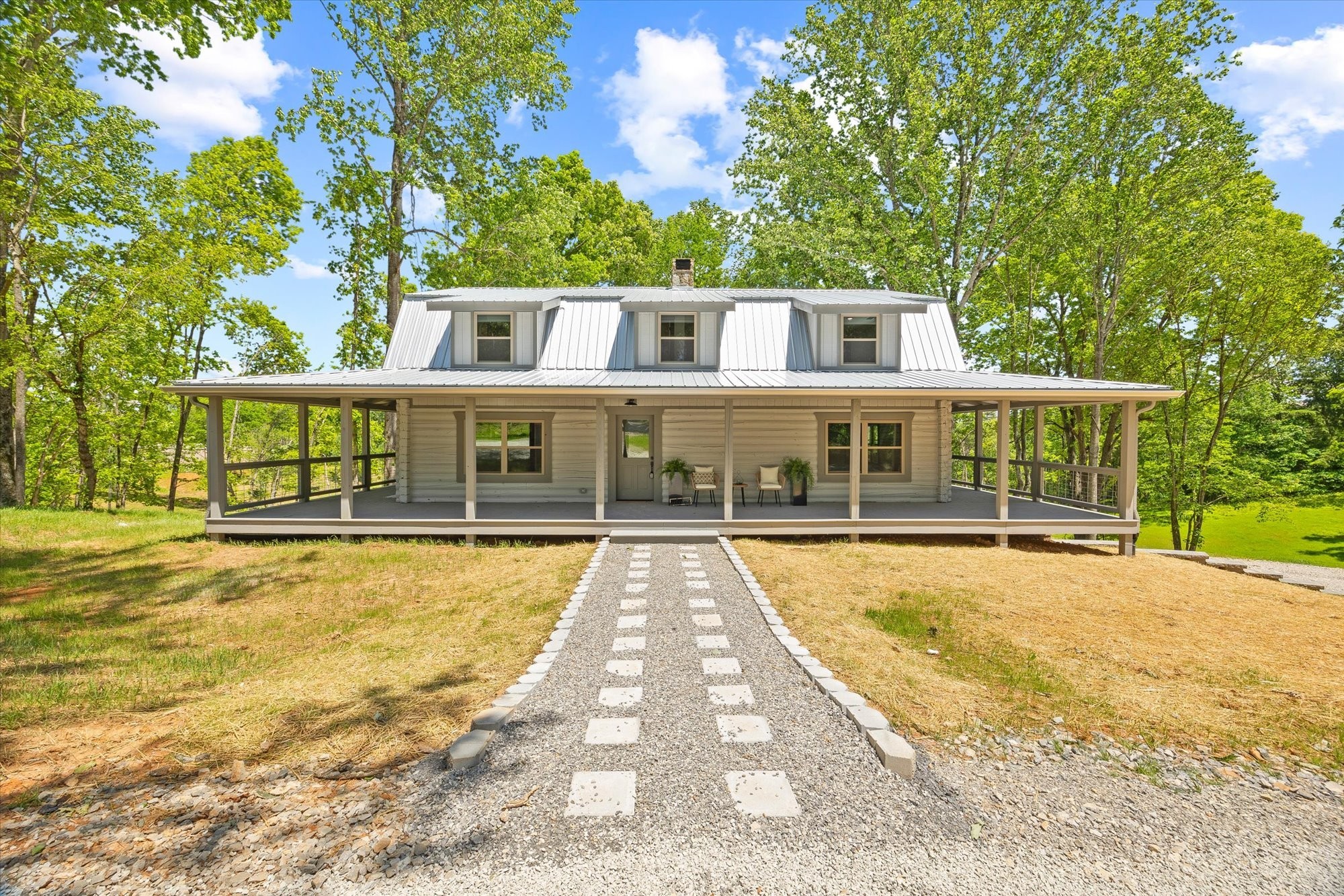 4221 New Hope Road Celina, TN 38551 - Photo 2 of 52 a front view of a house with a yard