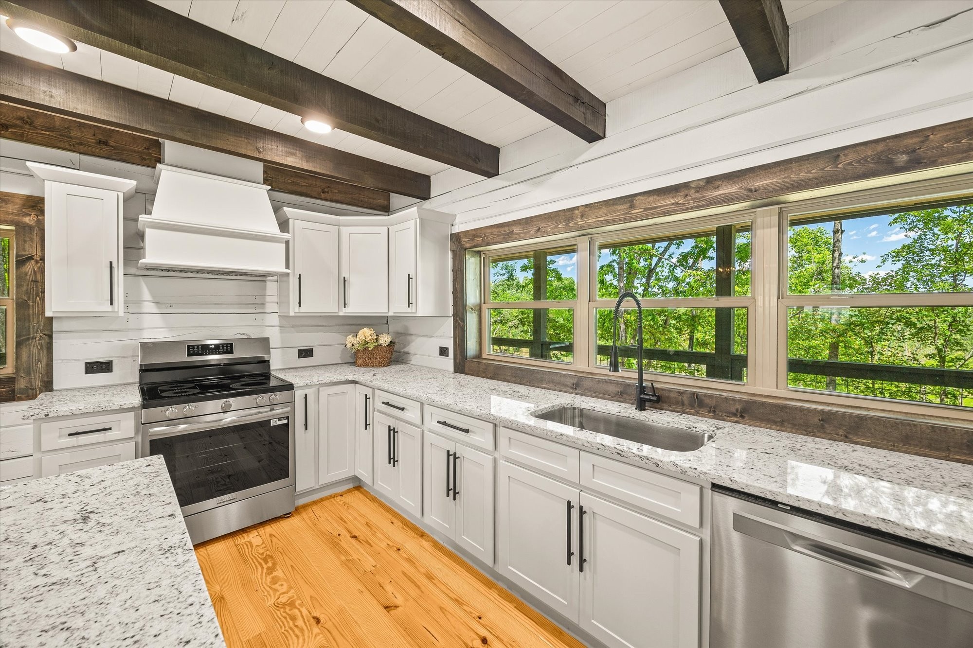 4221 New Hope Road Celina, TN 38551 - Photo 23 of 52 a kitchen with a sink stove and cabinets