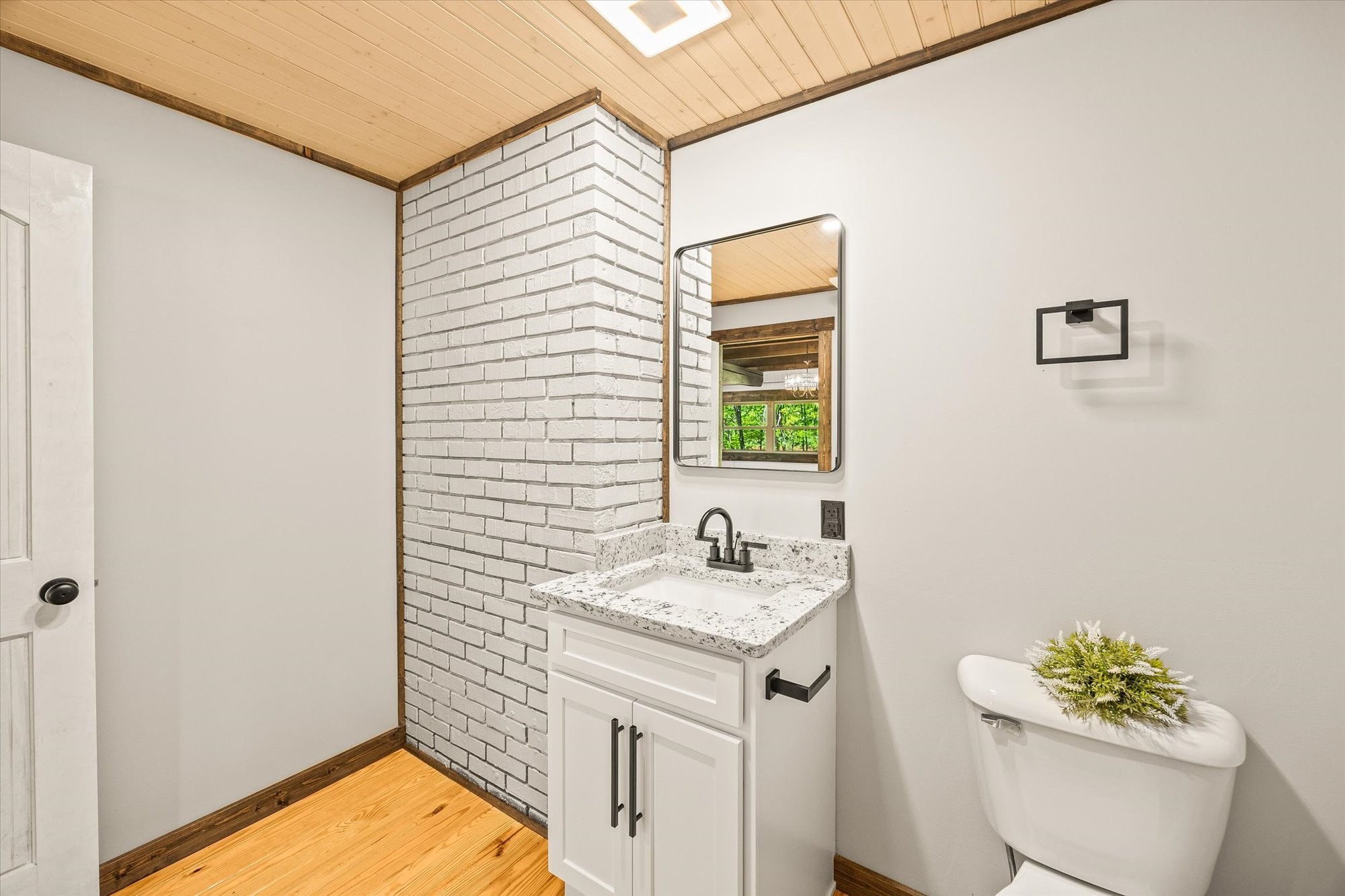 4221 New Hope Road Celina, TN 38551 - Photo 25 of 52 a bathroom with a sink a toilet and a mirror