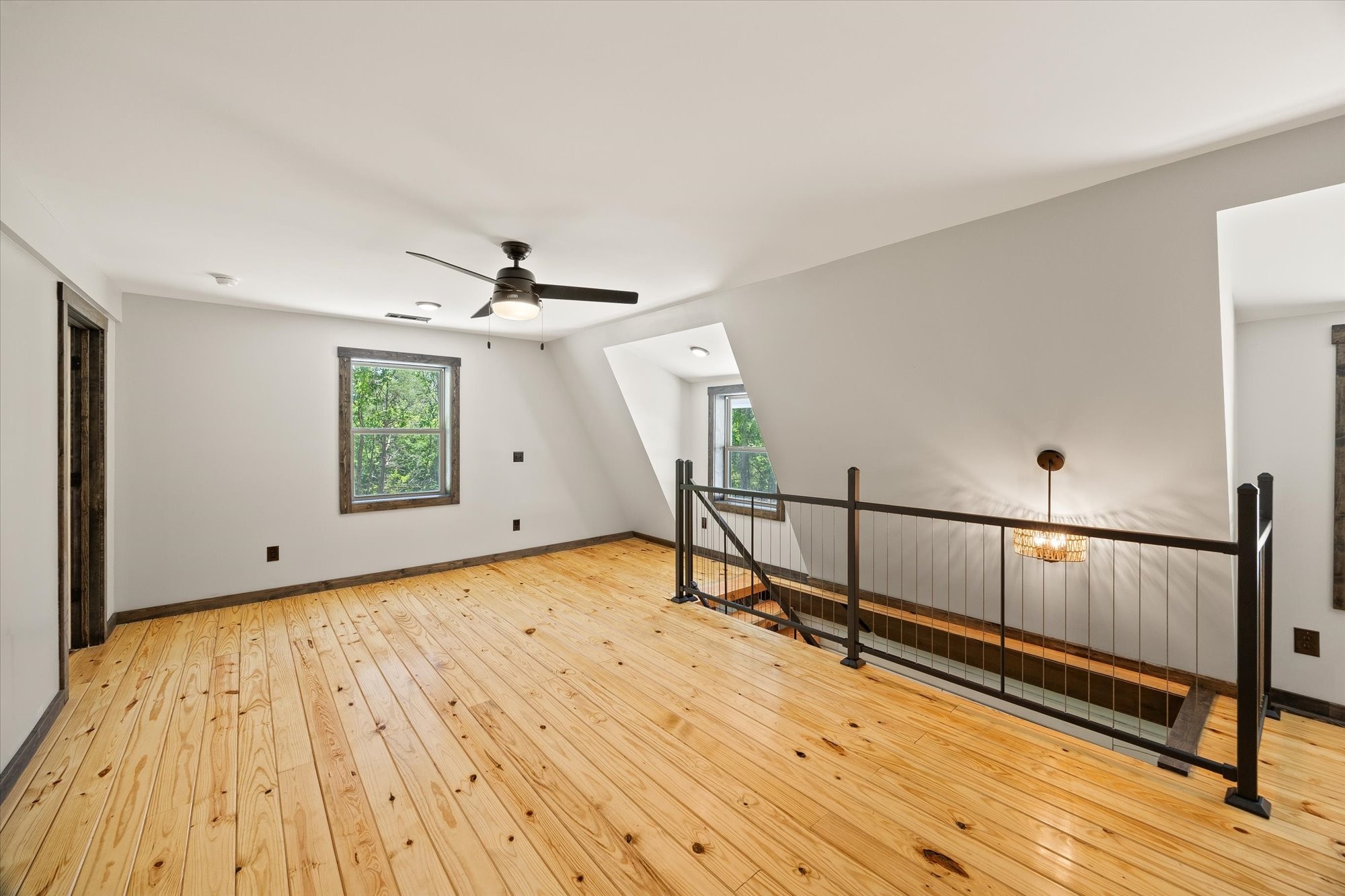 4221 New Hope Road Celina, TN 38551 - Photo 28 of 52 a view of empty room with wooden floor and fan