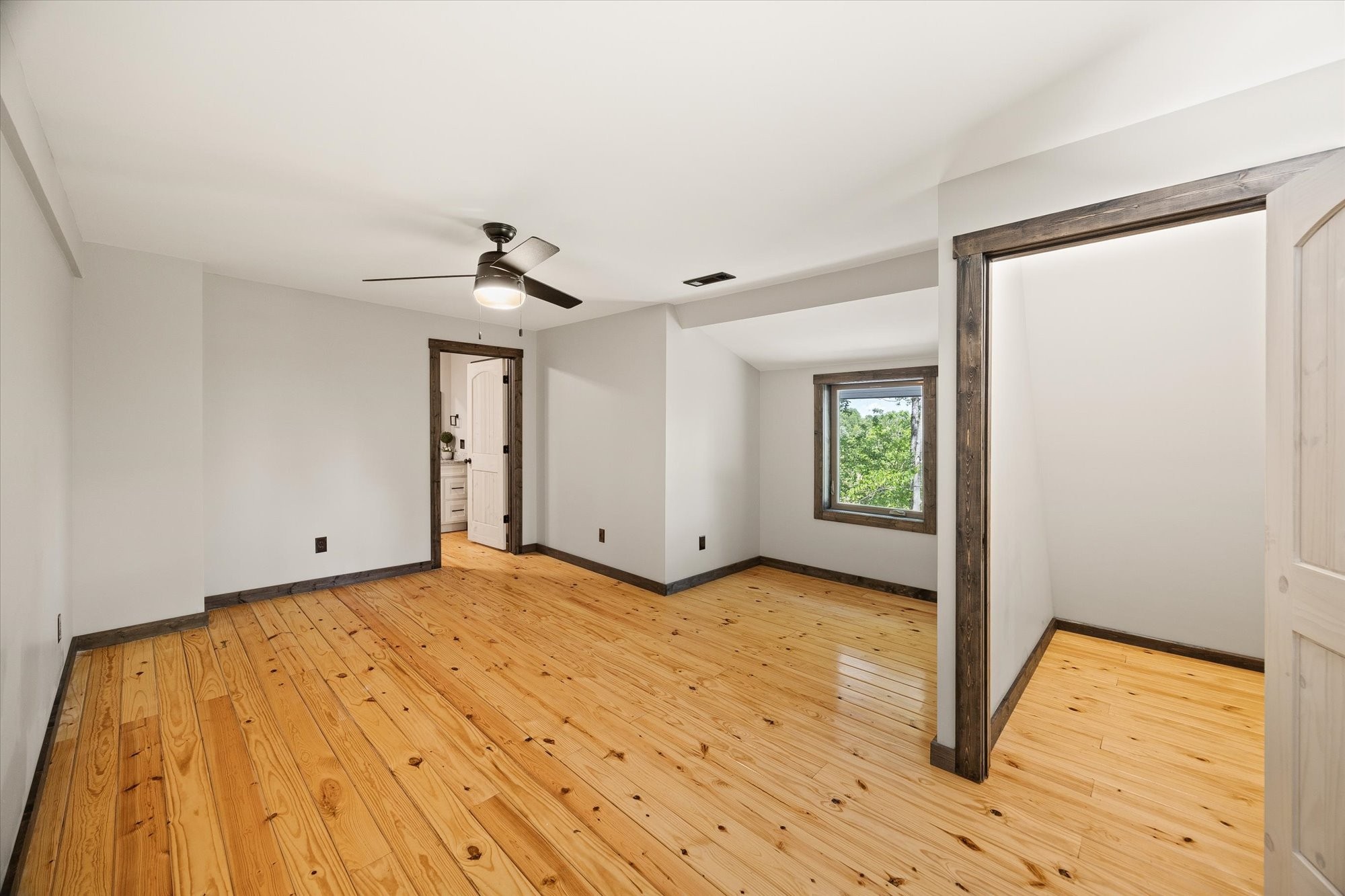 4221 New Hope Road Celina, TN 38551 - Photo 29 of 52 a view of empty room with wooden floor and fan